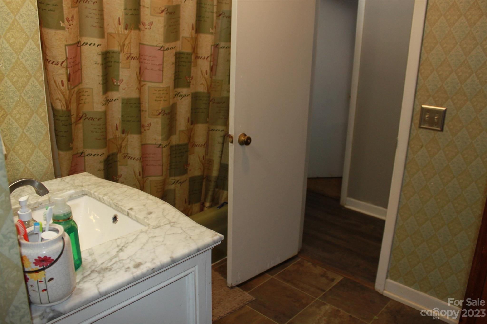 901 Coopers Gap Road Rutherfordton, NC 28139 - Photo 18 of 47 a bathroom with a granite countertop sink and a mirror