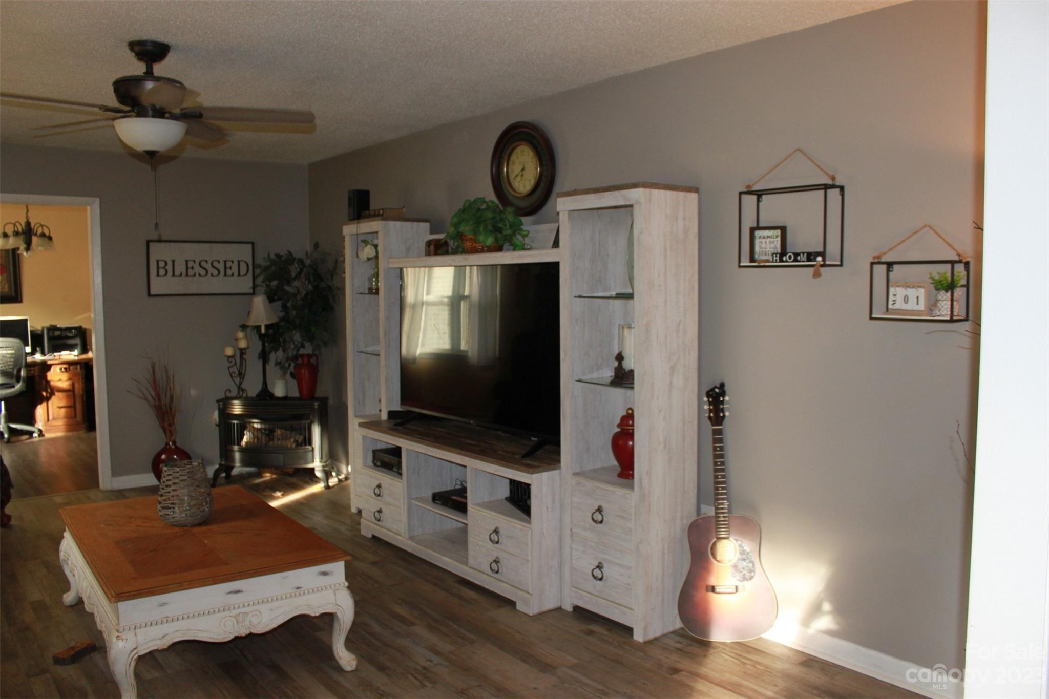 901 Coopers Gap Road Rutherfordton, NC 28139 - Photo 2 of 47 a living room with furniture and a flat screen tv