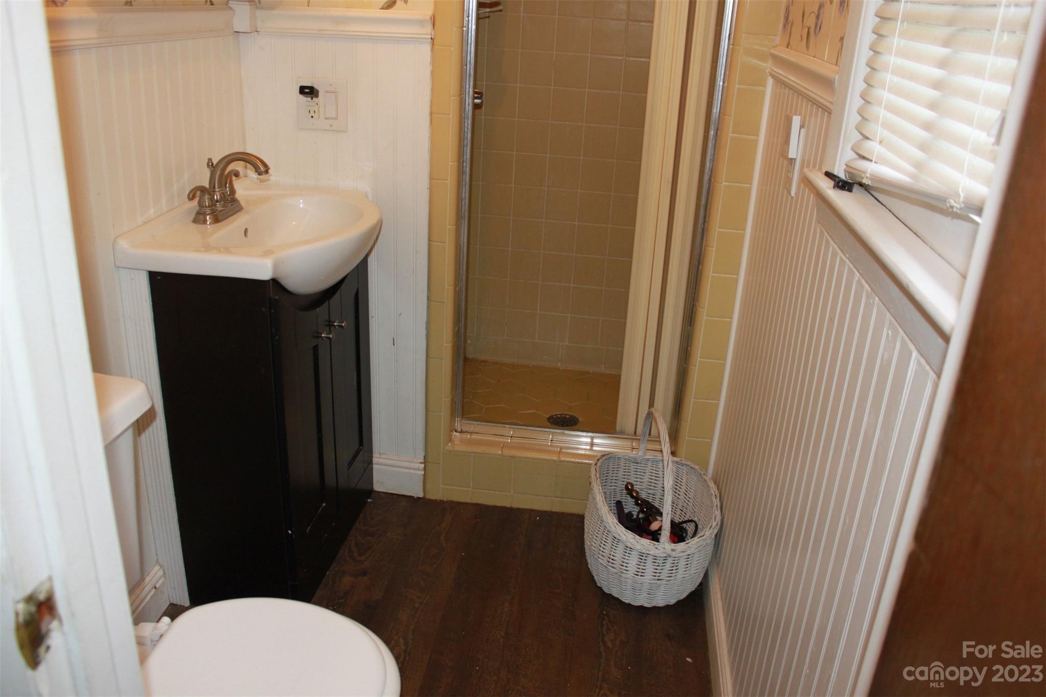 901 Coopers Gap Road Rutherfordton, NC 28139 - Photo 22 of 47 a bathroom with a sink a toilet a mirror and shower