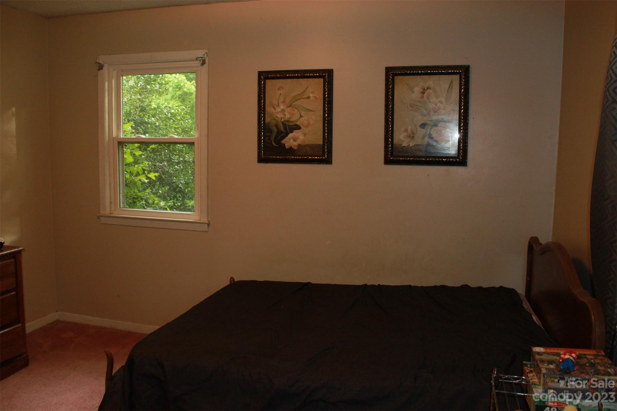 901 Coopers Gap Road Rutherfordton, NC 28139 - Photo 29 of 47 a view of a bedroom with wooden floor and a window