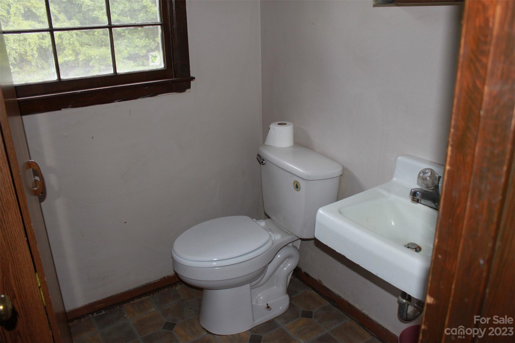 901 Coopers Gap Road Rutherfordton, NC 28139 - Photo 31 of 47 a white toilet sitting next to a bathroom sink