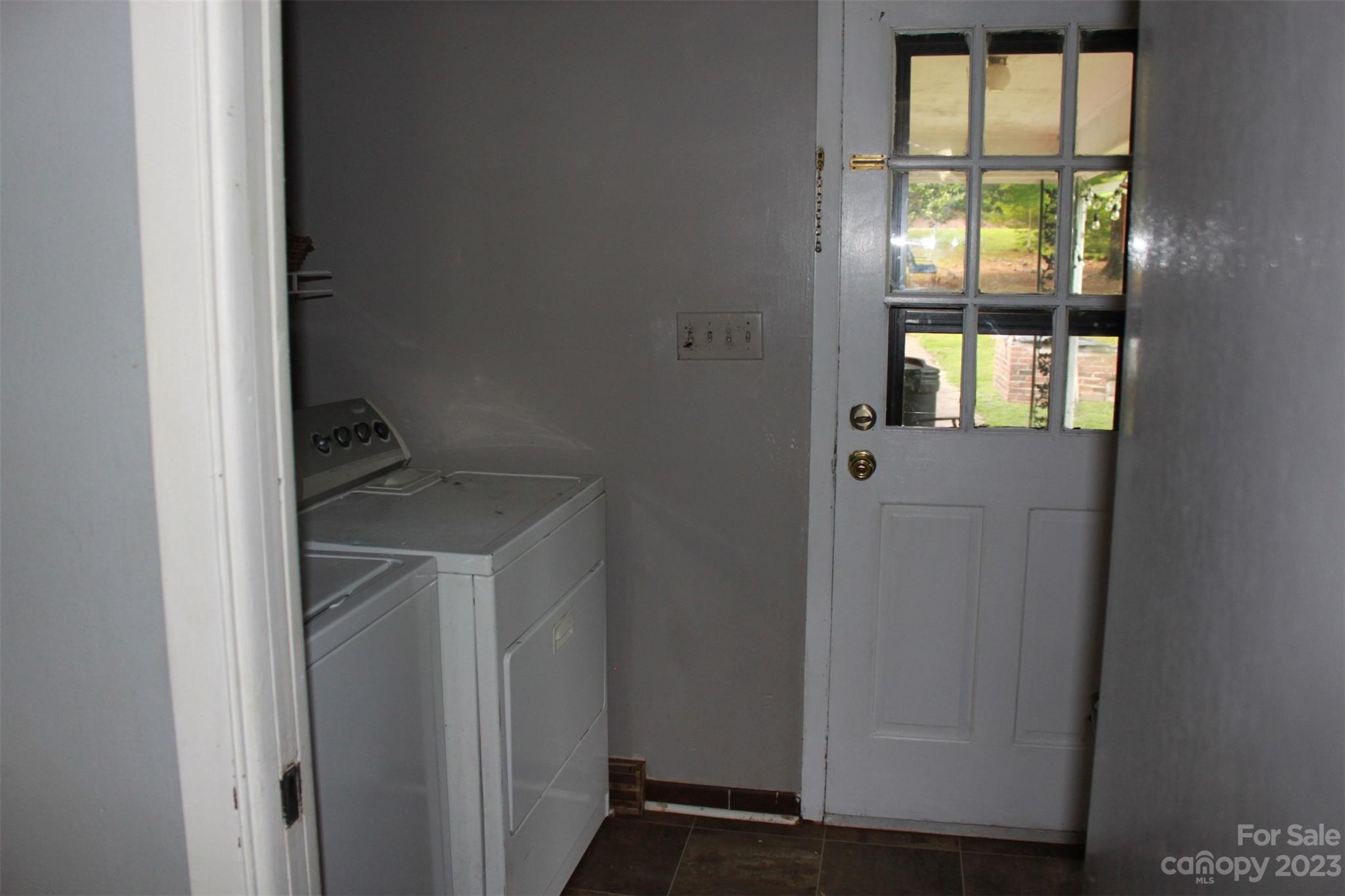 901 Coopers Gap Road Rutherfordton, NC 28139 - Photo 32 of 47 a utility room with window and refrigerator