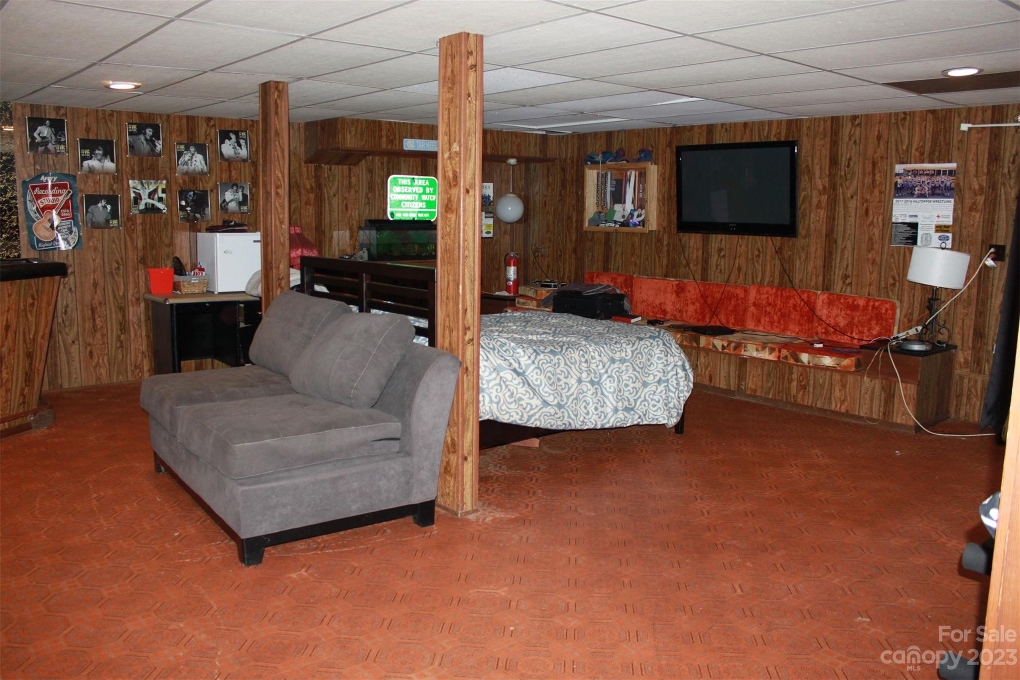 901 Coopers Gap Road Rutherfordton, NC 28139 - Photo 33 of 47 a living room with furniture and a flat screen tv