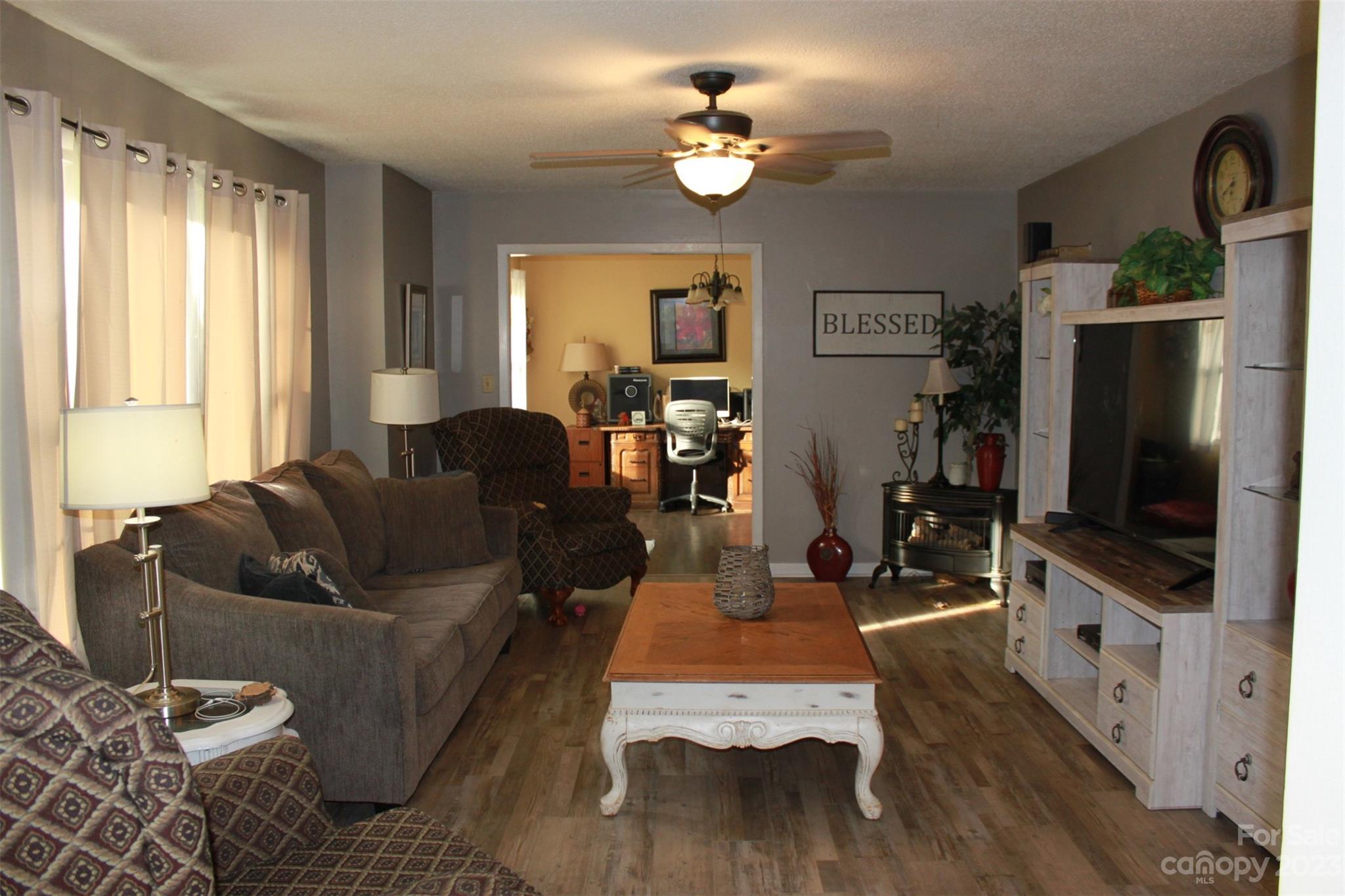 901 Coopers Gap Road Rutherfordton, NC 28139 - Photo 4 of 47 a living room with furniture fireplace and flat screen tv