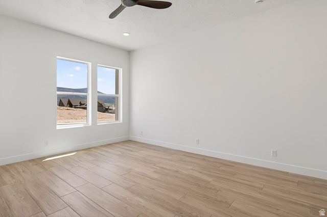 2862 South Mountain Rnch Road Cedar City, UT 84720 - Photo 46 of 64 Spacious room with light wood-finish flooring, white walls, and a ceiling fan