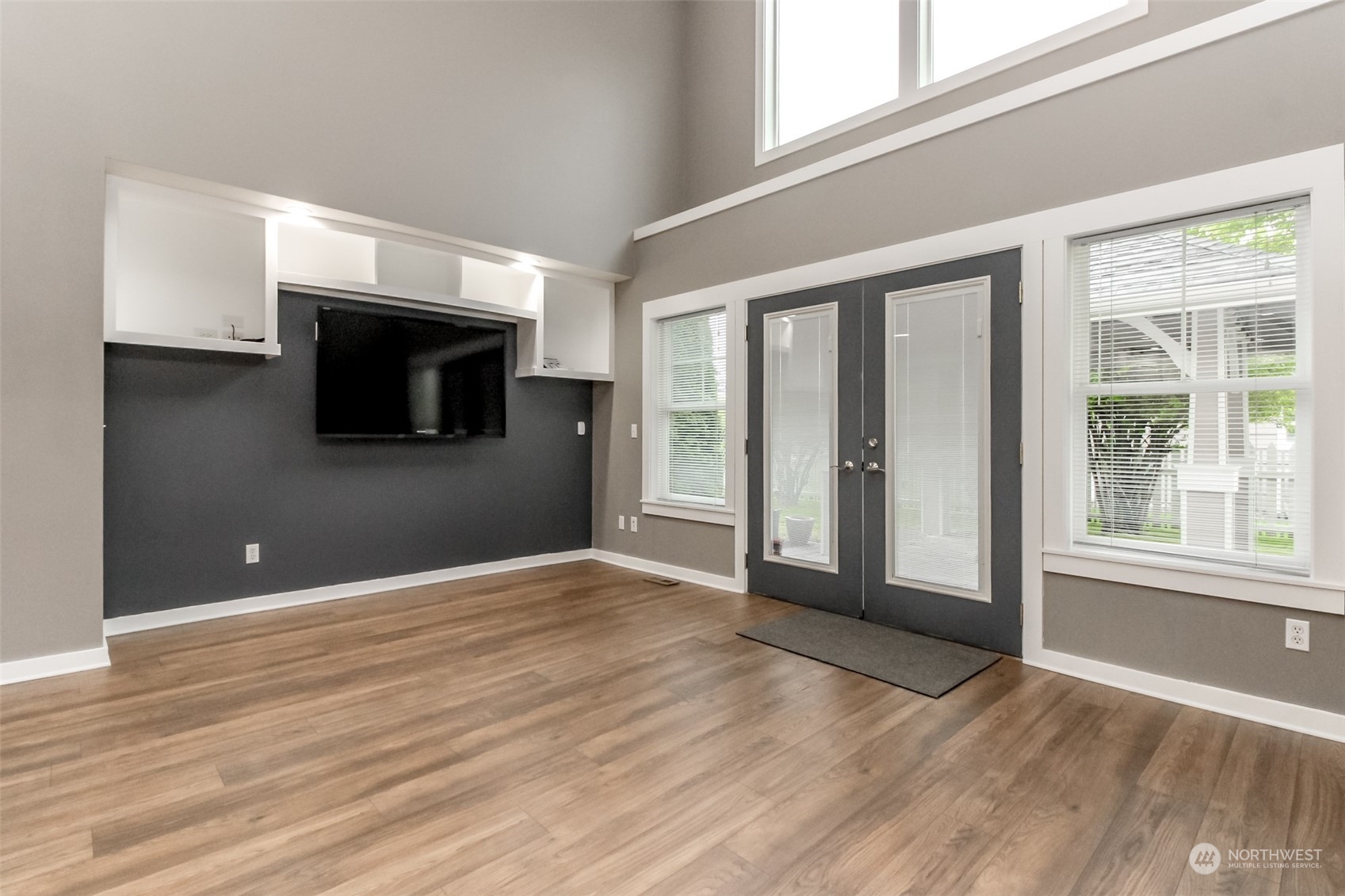 3924 Gay Road East Tacoma, WA 98443 - Photo 11 of 38 a view of an empty room with wooden floor and a window