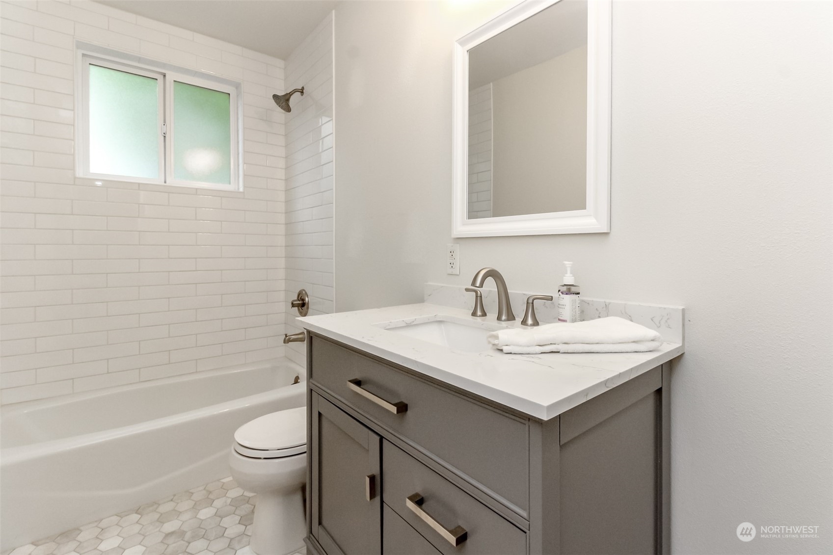 3924 Gay Road East Tacoma, WA 98443 - Photo 15 of 38 a bathroom with a granite countertop sink toilet and shower