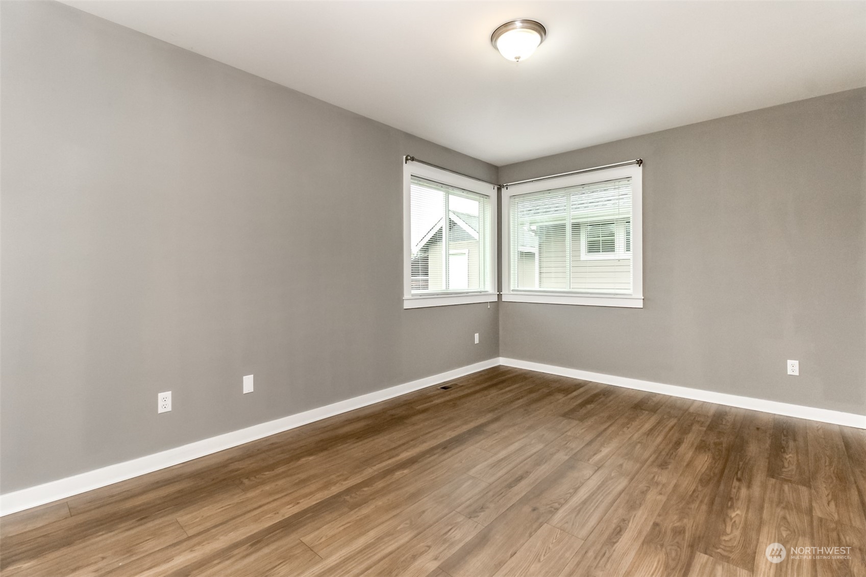 3924 Gay Road East Tacoma, WA 98443 - Photo 17 of 38 a view of an empty room with wooden floor and a window