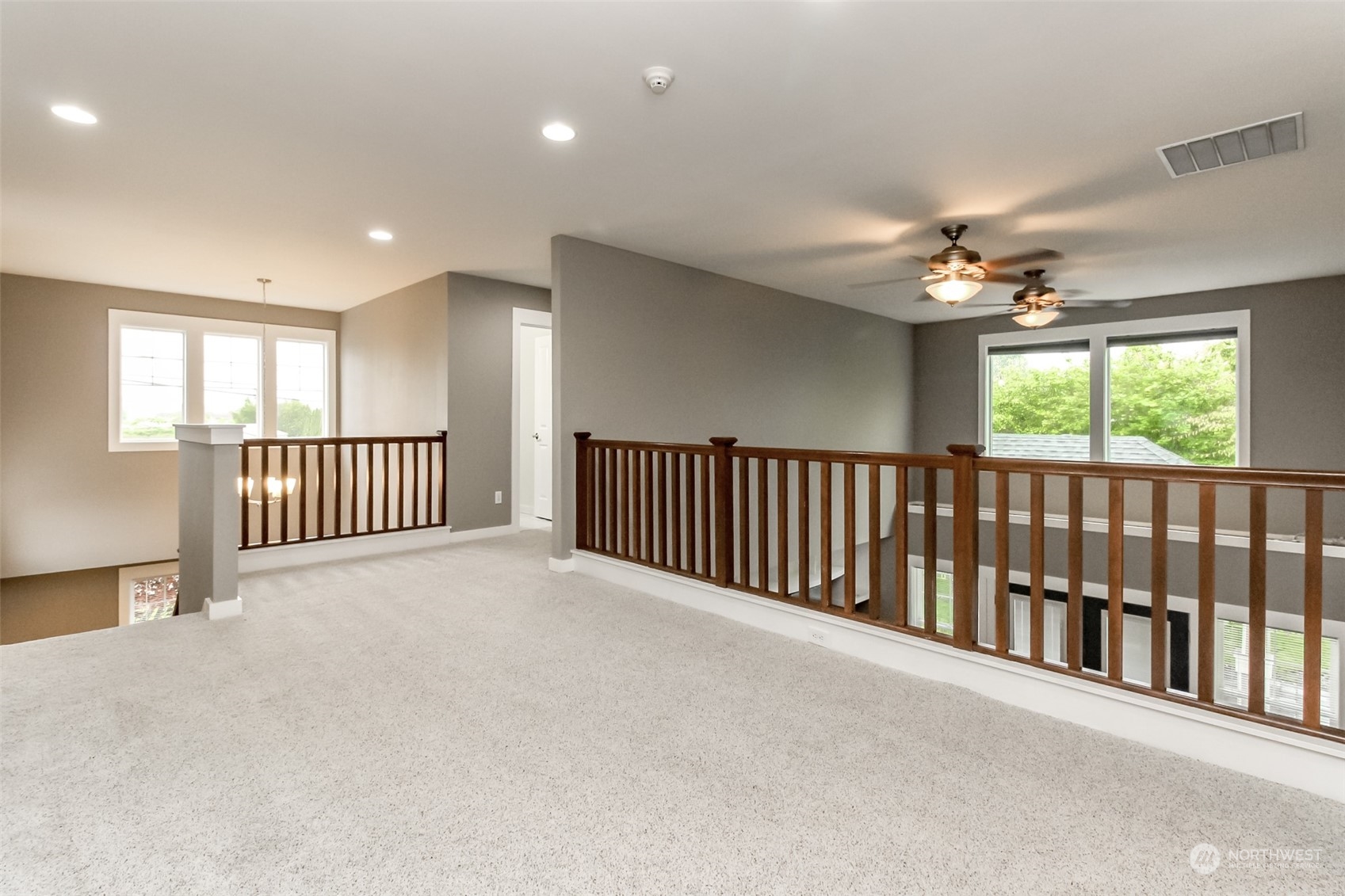 3924 Gay Road East Tacoma, WA 98443 - Photo 21 of 38 a view of staircase with stairs and a chandelier