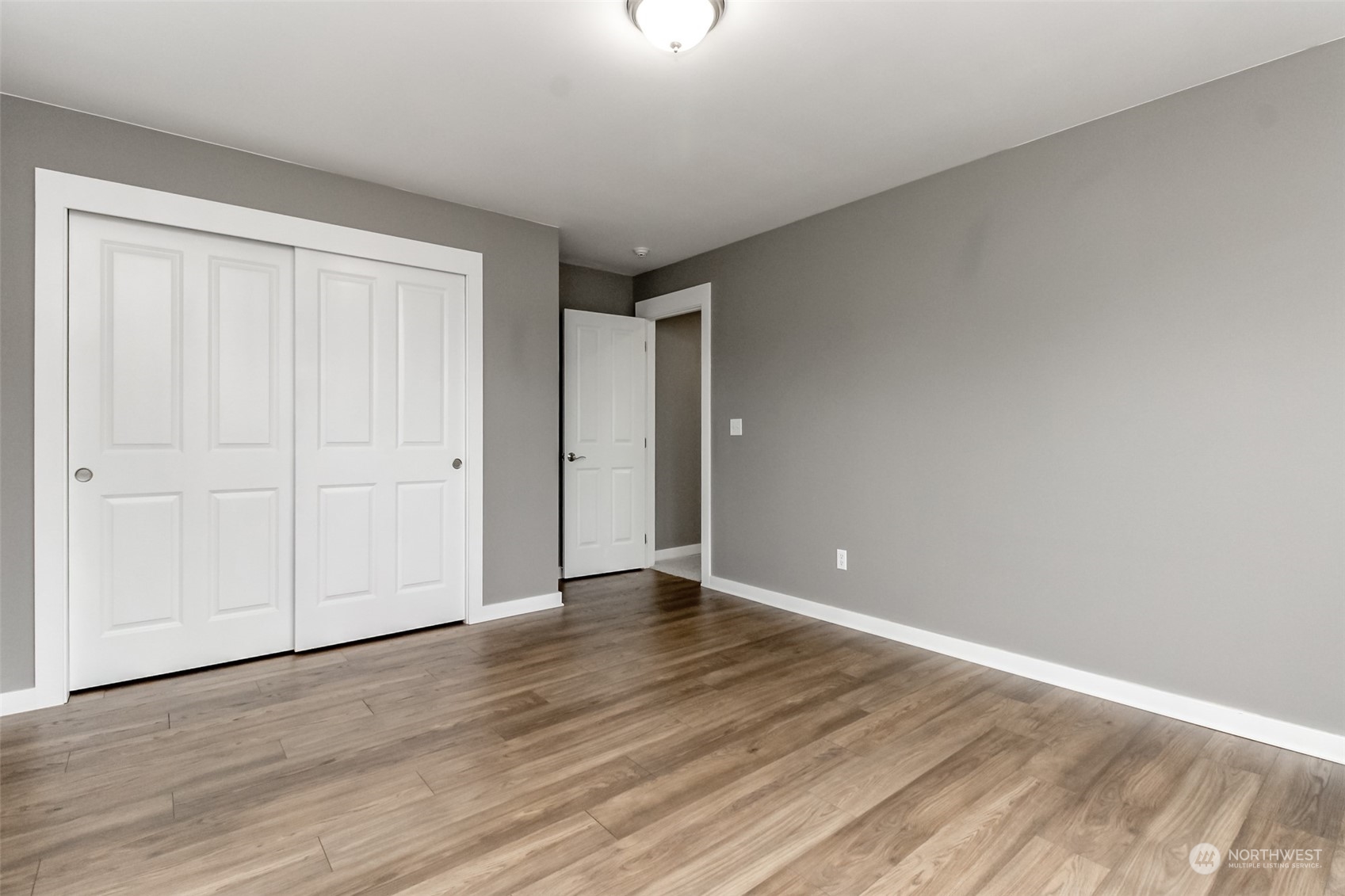 3924 Gay Road East Tacoma, WA 98443 - Photo 25 of 38 a view of an empty room with wooden floor