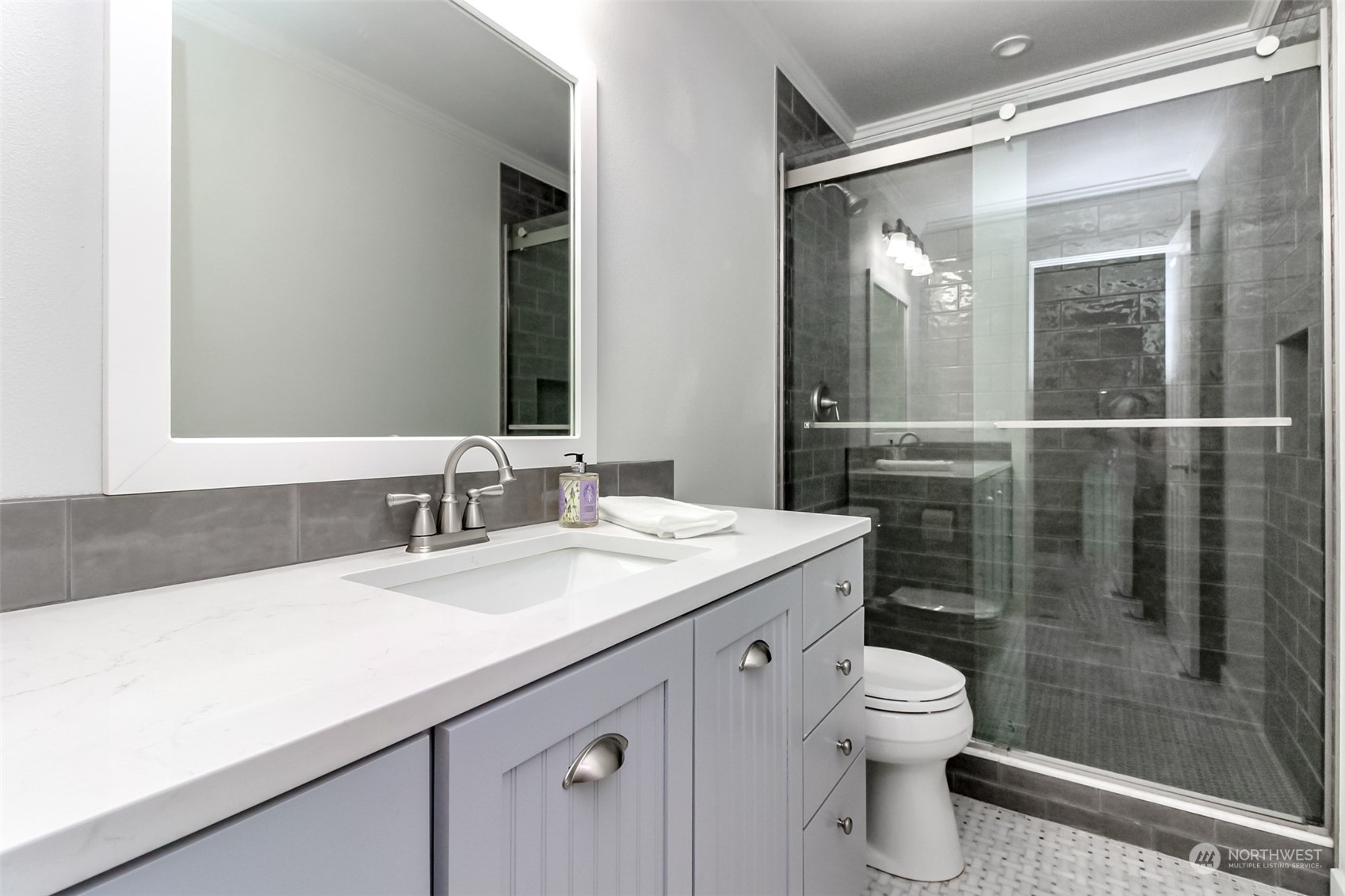 3924 Gay Road East Tacoma, WA 98443 - Photo 26 of 38 a bathroom with a sink toilet and shower