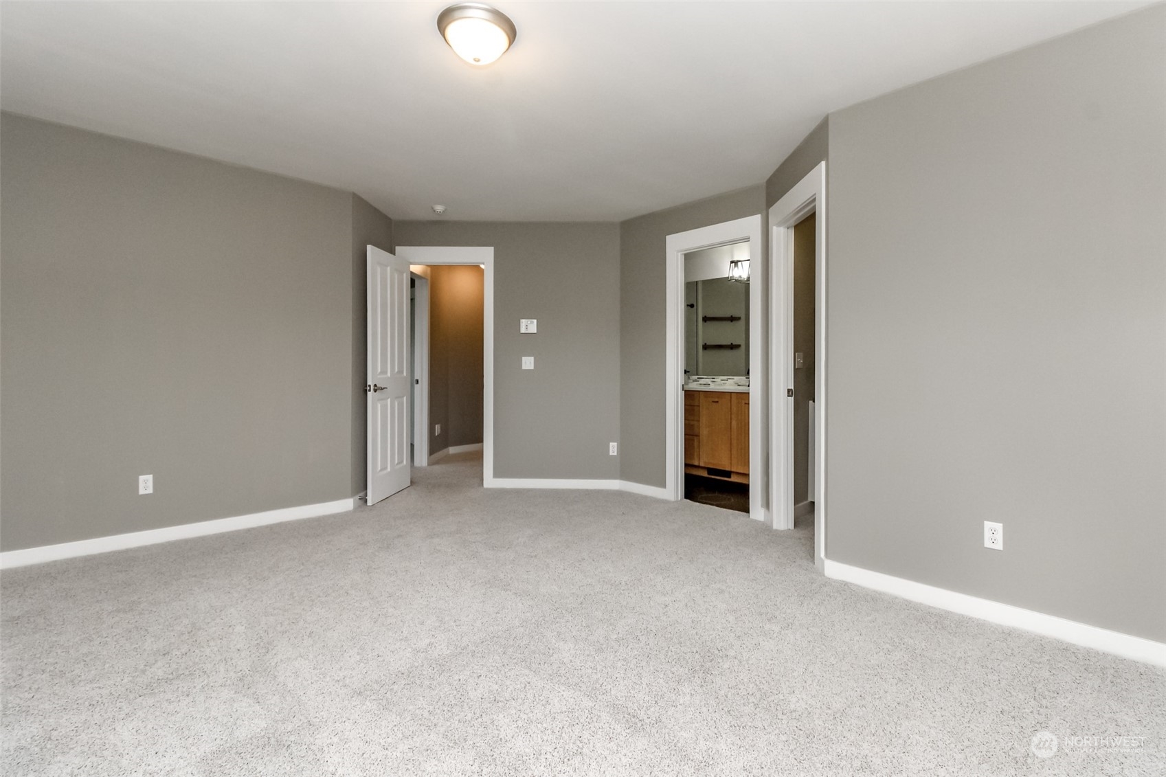 3924 Gay Road East Tacoma, WA 98443 - Photo 29 of 38 an empty room with closet and wooden door