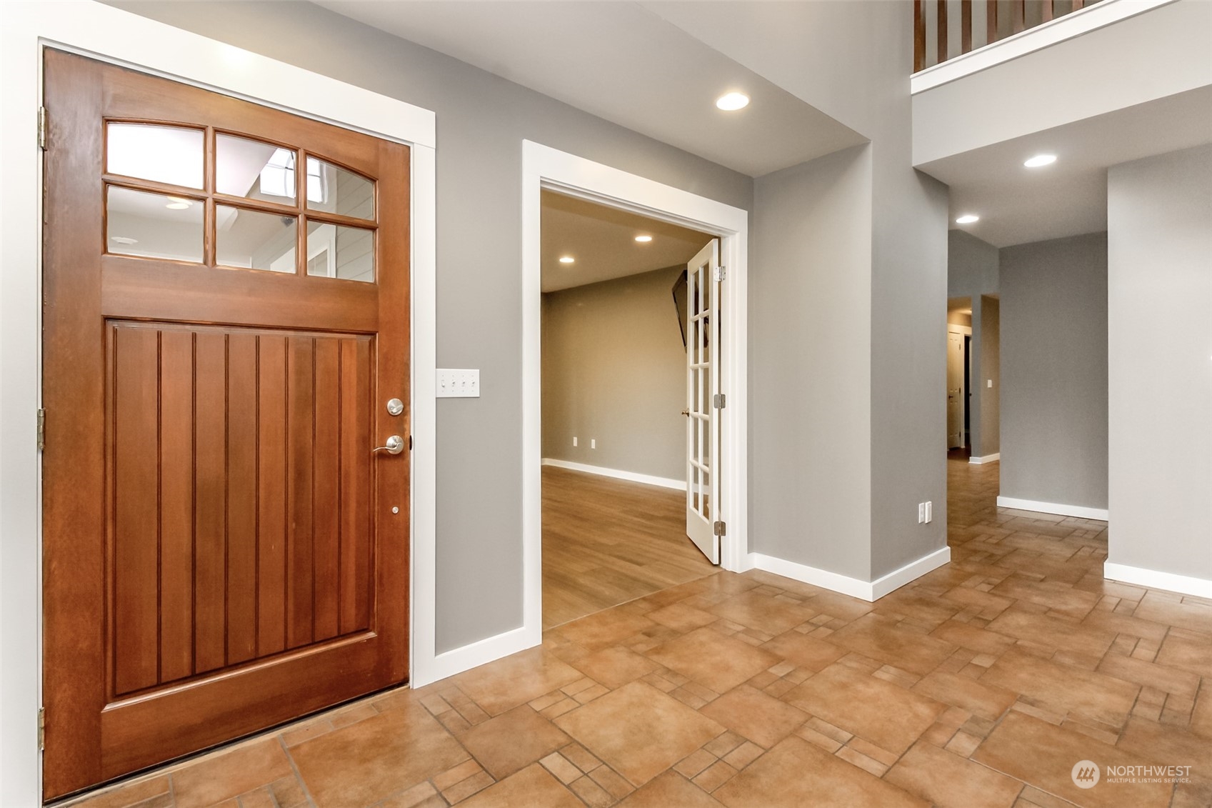 3924 Gay Road East Tacoma, WA 98443 - Photo 3 of 38 a view of a hallway with wooden floor and a cabinet
