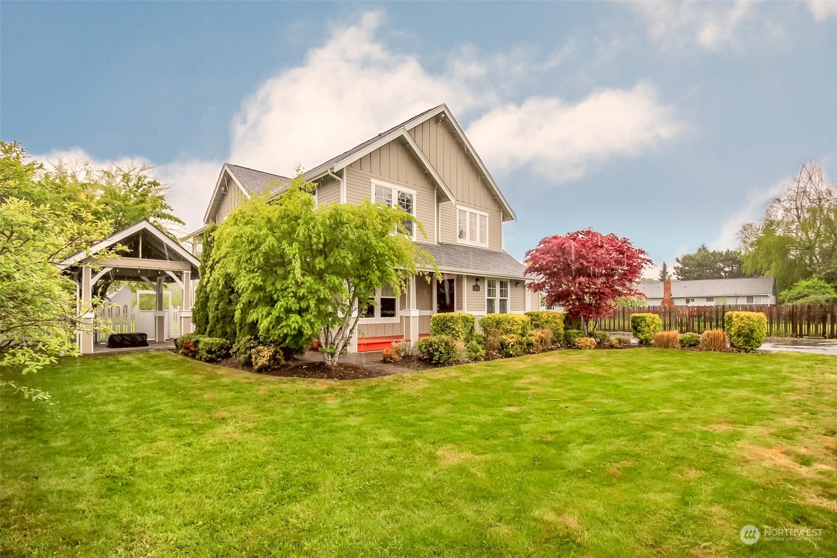 3924 Gay Road East Tacoma, WA 98443 - Photo 36 of 38 a view of a house with a big yard and large trees
