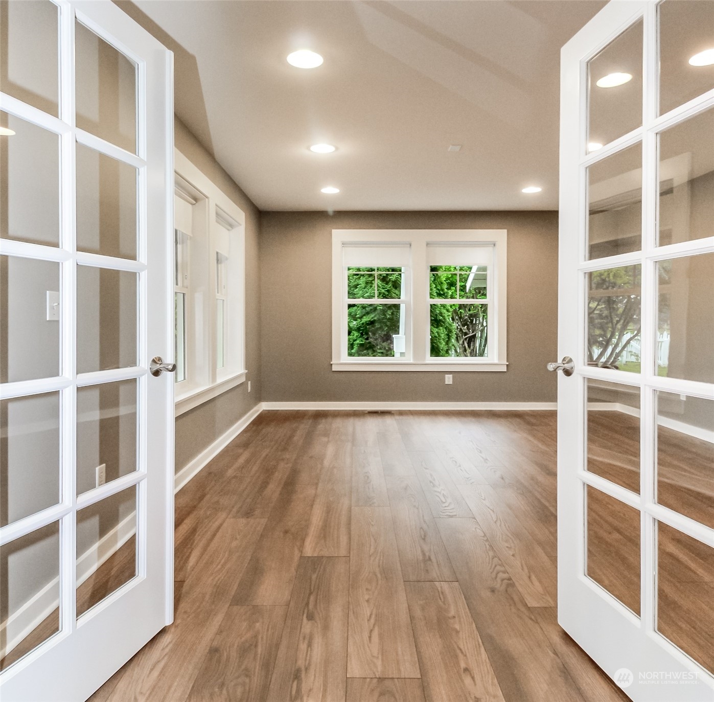3924 Gay Road East Tacoma, WA 98443 - Photo 5 of 38 wooden floor in an empty room with a window and wooden floor