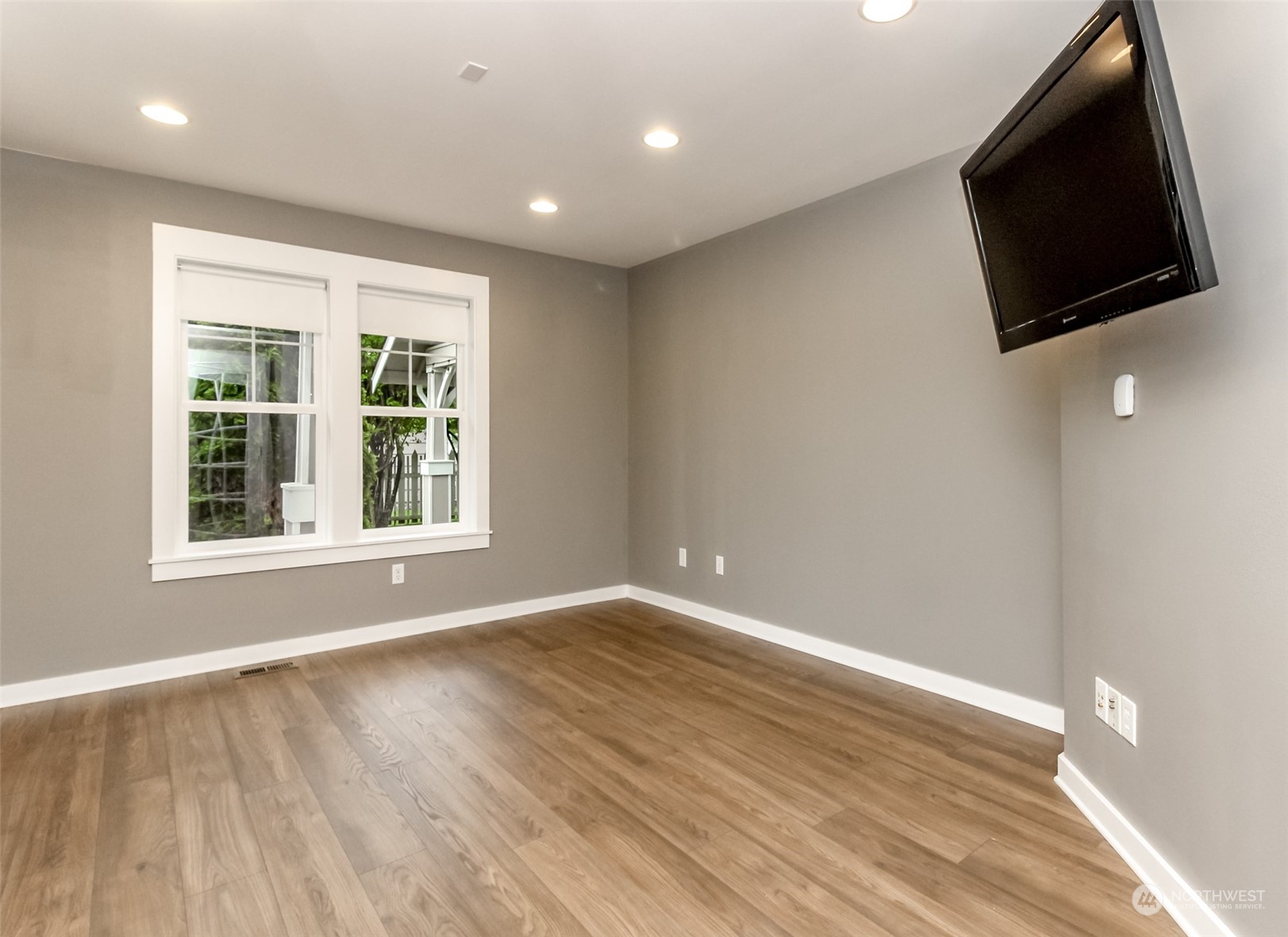 3924 Gay Road East Tacoma, WA 98443 - Photo 6 of 38 an empty room with wooden floor and windows