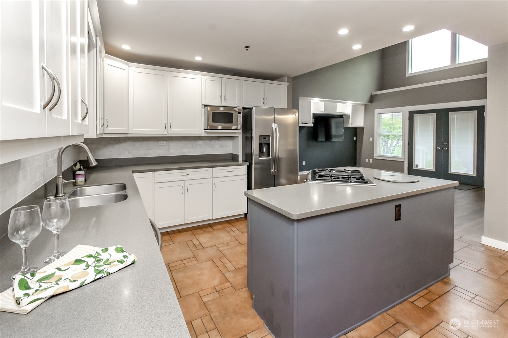 3924 Gay Road East Tacoma, WA 98443 - Photo 8 of 38 a kitchen with stainless steel appliances granite countertop a sink stove and refrigerator