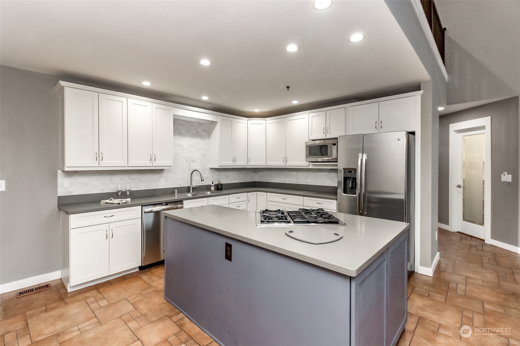 3924 Gay Road East Tacoma, WA 98443 - Photo 9 of 38 a kitchen with stainless steel appliances granite countertop a sink stove and refrigerator