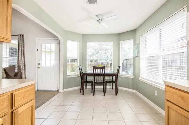 a dining room with furniture and window