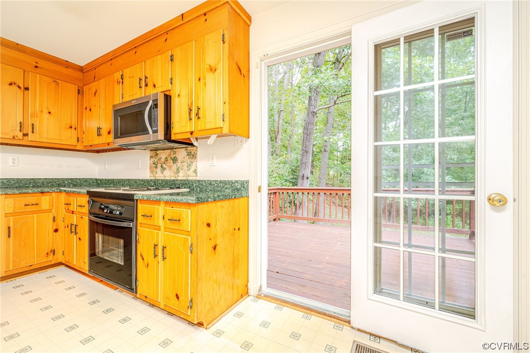 3207 Ludgate Road Chester, VA 23831 - Photo 11 of 44 a kitchen with stainless steel appliances granite countertop a stove and a sink