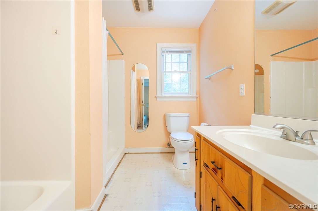 3207 Ludgate Road Chester, VA 23831 - Photo 15 of 44 a bathroom with a sink and a mirror