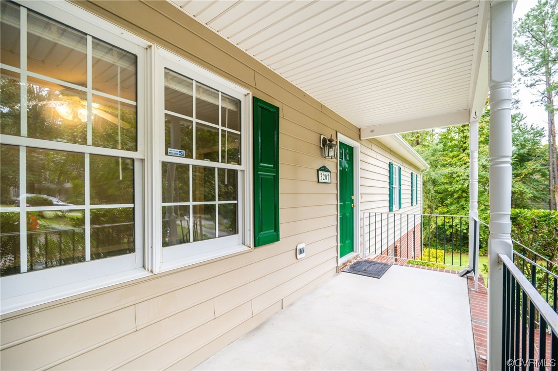 3207 Ludgate Road Chester, VA 23831 - Photo 3 of 44 a view of front door with wooden floor and fence