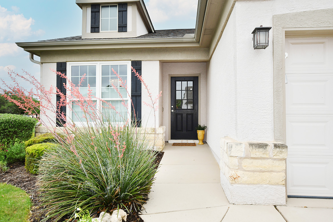 203 Winter Drive Georgetown, TX 78633 - Photo 3 of 29 Crisp black shutters create an attractive walk-up at this Bayberry garden home.