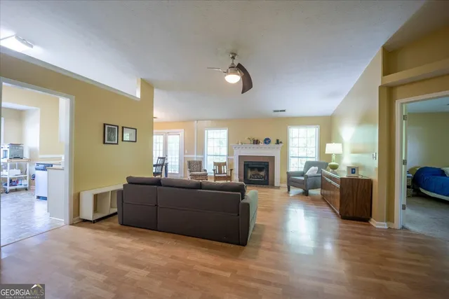 a living room with furniture and a fireplace