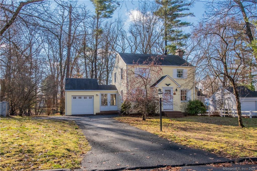 85 Cavan Road East Hartford, CT 06118 - Photo 1 of 1 a view of a white house with a yard covered with snow