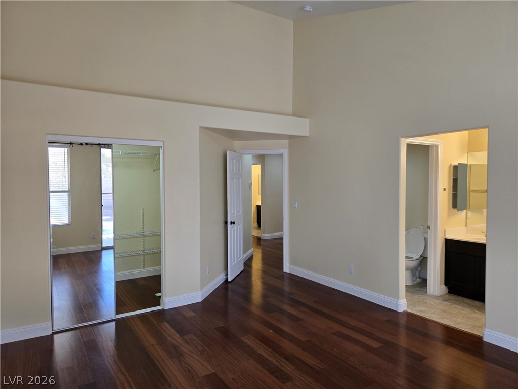 8417 San Ramon Drive Las Vegas, NV 89147 - Photo 24 of 33 Rich hardwood floors create a warm, inviting atmosphere, complemented by a convenient mirrored closet.