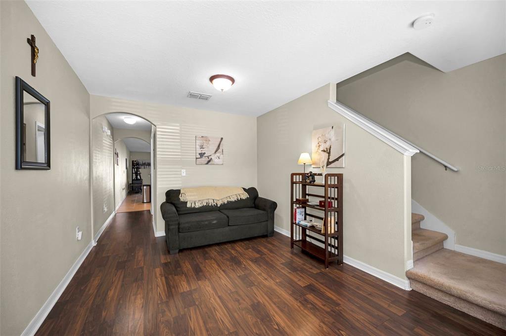 9736 Trumpet Vine Loop Trinity, FL 34655 - Photo 16 of 35 a living room with furniture and wooden floor
