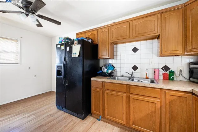 a kitchen with stainless steel appliances a refrigerator and sink