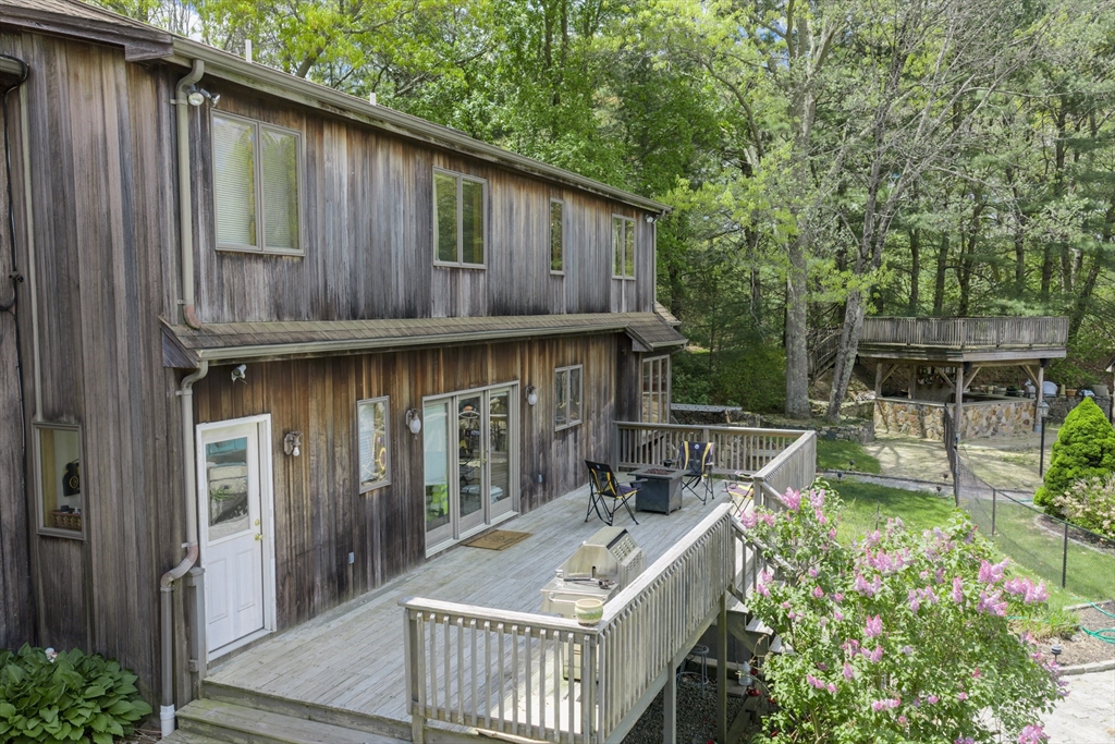 42 Pine Acres Road Foxboro, MA 02035 - Photo 31 of 40 a house view with a backyard space