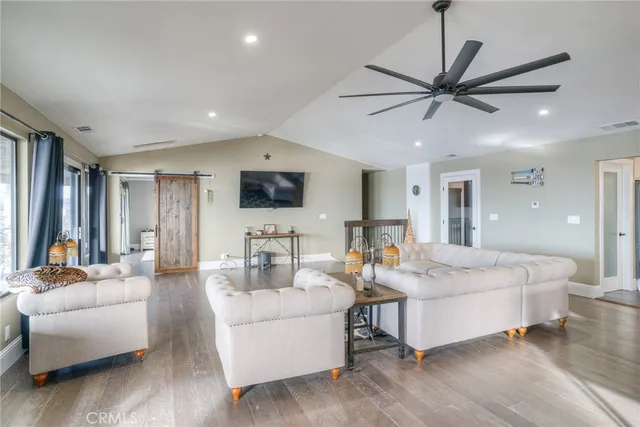 a kitchen with stainless steel appliances granite countertop a stove a sink and a white cabinets