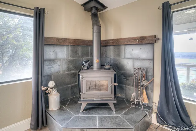a kitchen with kitchen island granite countertop appliances cabinets and a sink