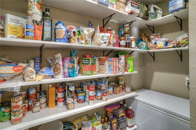 a bedroom with a large bed and a couch