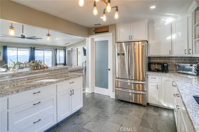 a spacious bedroom with a large bed and a large window