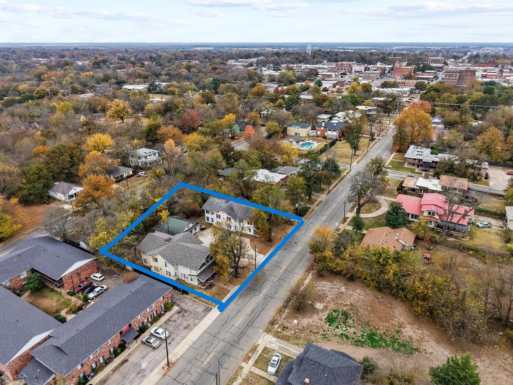 646 South Main Street Paris, TX 75460 - Photo 1 of 39 an aerial view of a residential houses with city view