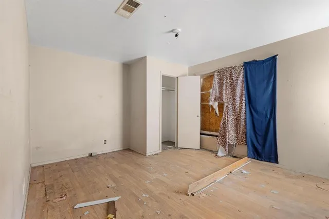 a kitchen with a refrigerator and a stove