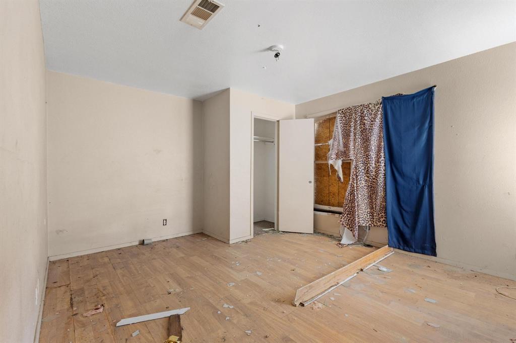 646 South Main Street Paris, TX 75460 - Photo 15 of 39 a view of a bedroom with closet and bathroom