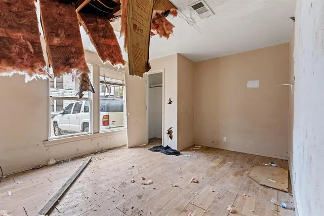 a kitchen with stainless steel appliances granite countertop a refrigerator and a stove