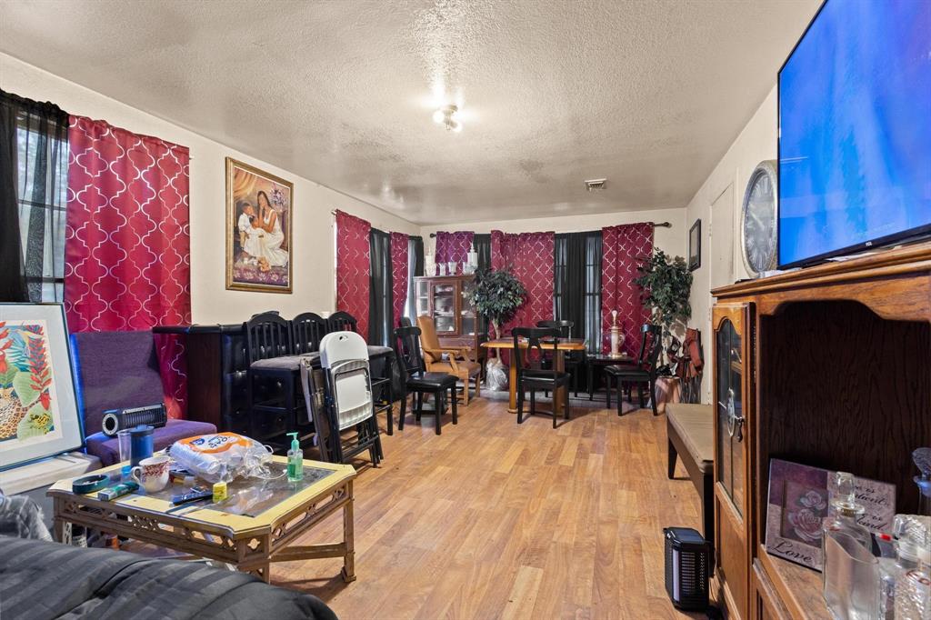 646 South Main Street Paris, TX 75460 - Photo 21 of 39 a living room with furniture and wooden floor