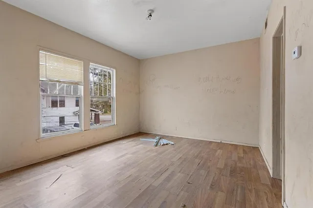 a bathroom with a sink mirror vanity and toilet