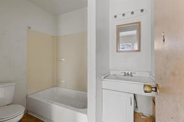 a kitchen with stainless steel appliances a refrigerator and a stove