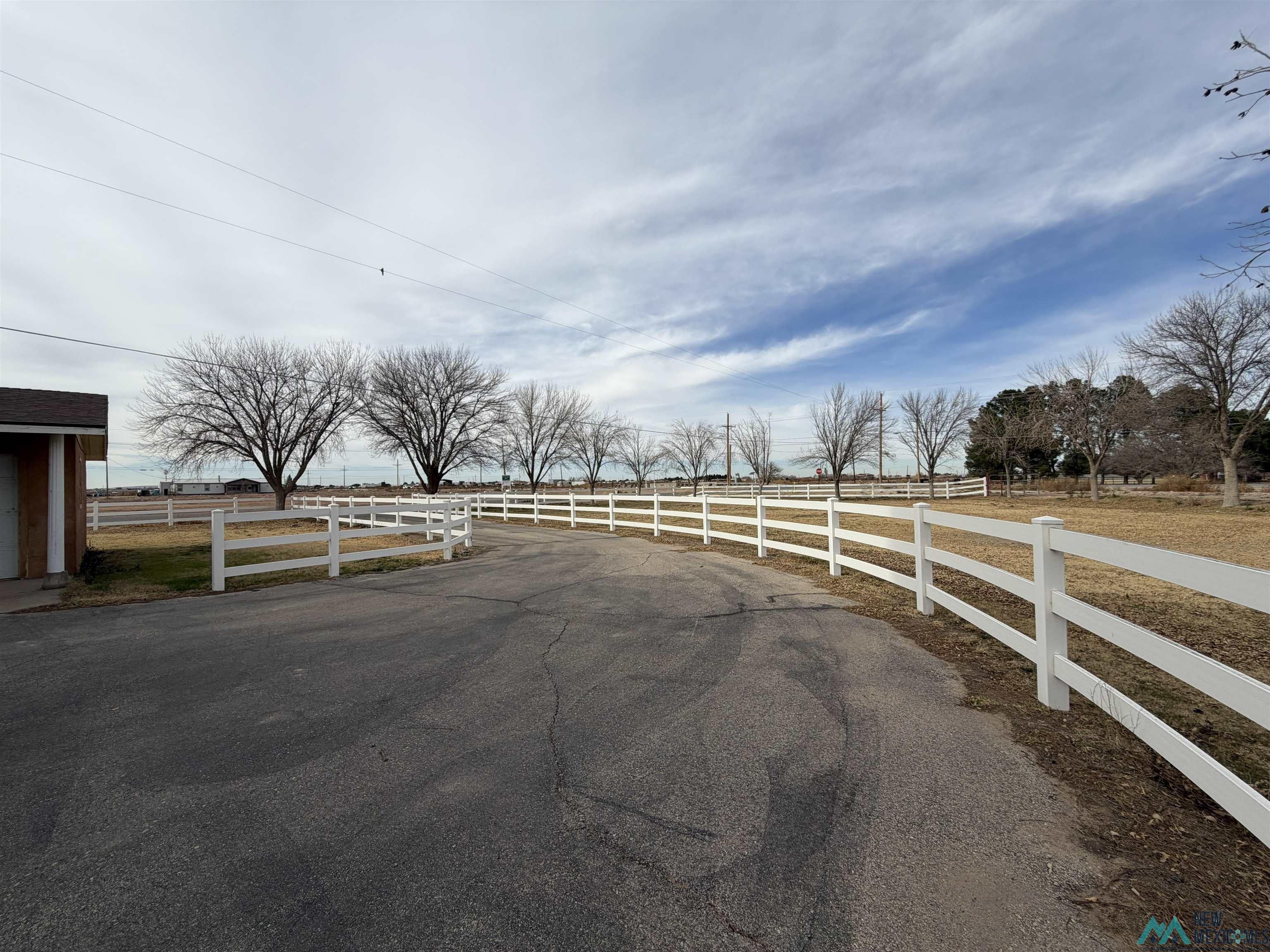 2001 East Derrick Road Carlsbad, NM 88220 - Photo 6 of 84 View of asphalt road featuring a rural view