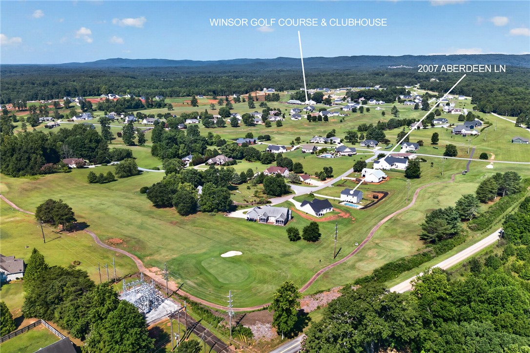 2007 Aberdeen Lane Walhalla, SC 29691 - Photo 36 of 41 An aerial perspective reveals a vibrant golf course community, blending lush greens with residential comfort.