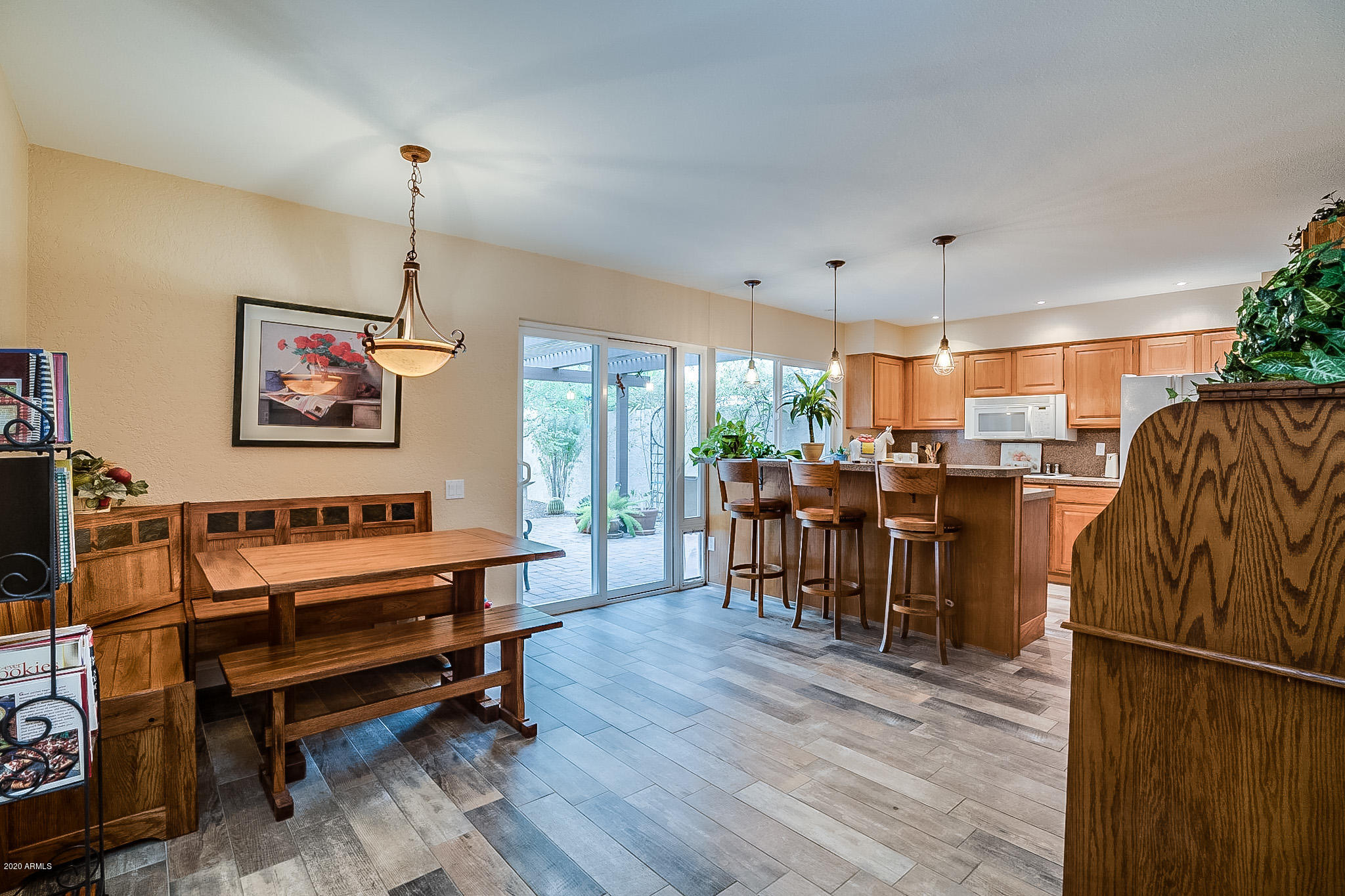 5630 South Outrigger Road Tempe, AZ 85283 - Photo 13 of 38 a living room with furniture a dining table and a flat screen tv