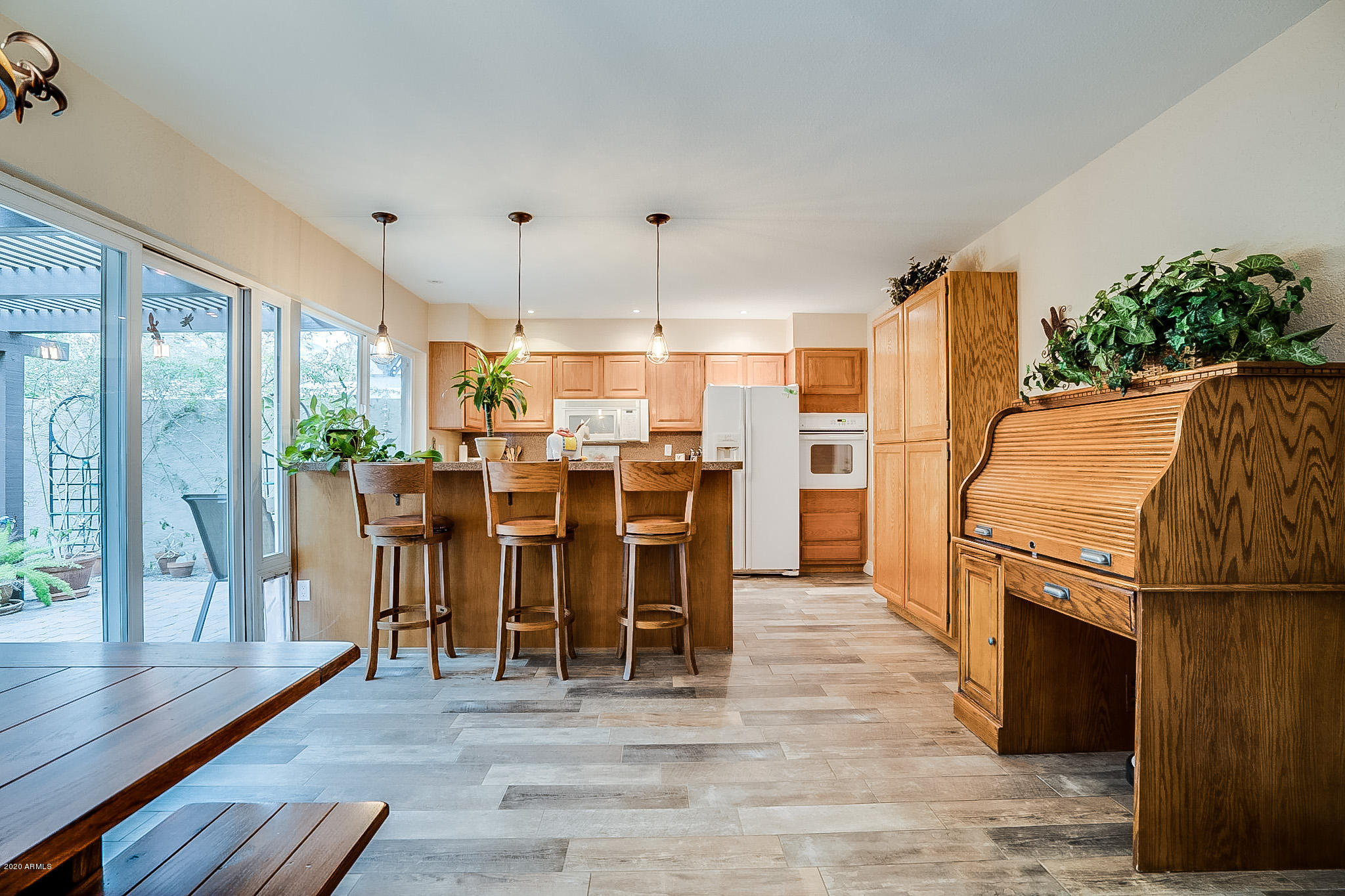 5630 South Outrigger Road Tempe, AZ 85283 - Photo 15 of 38 a dining room filled with furniture and wooden floor