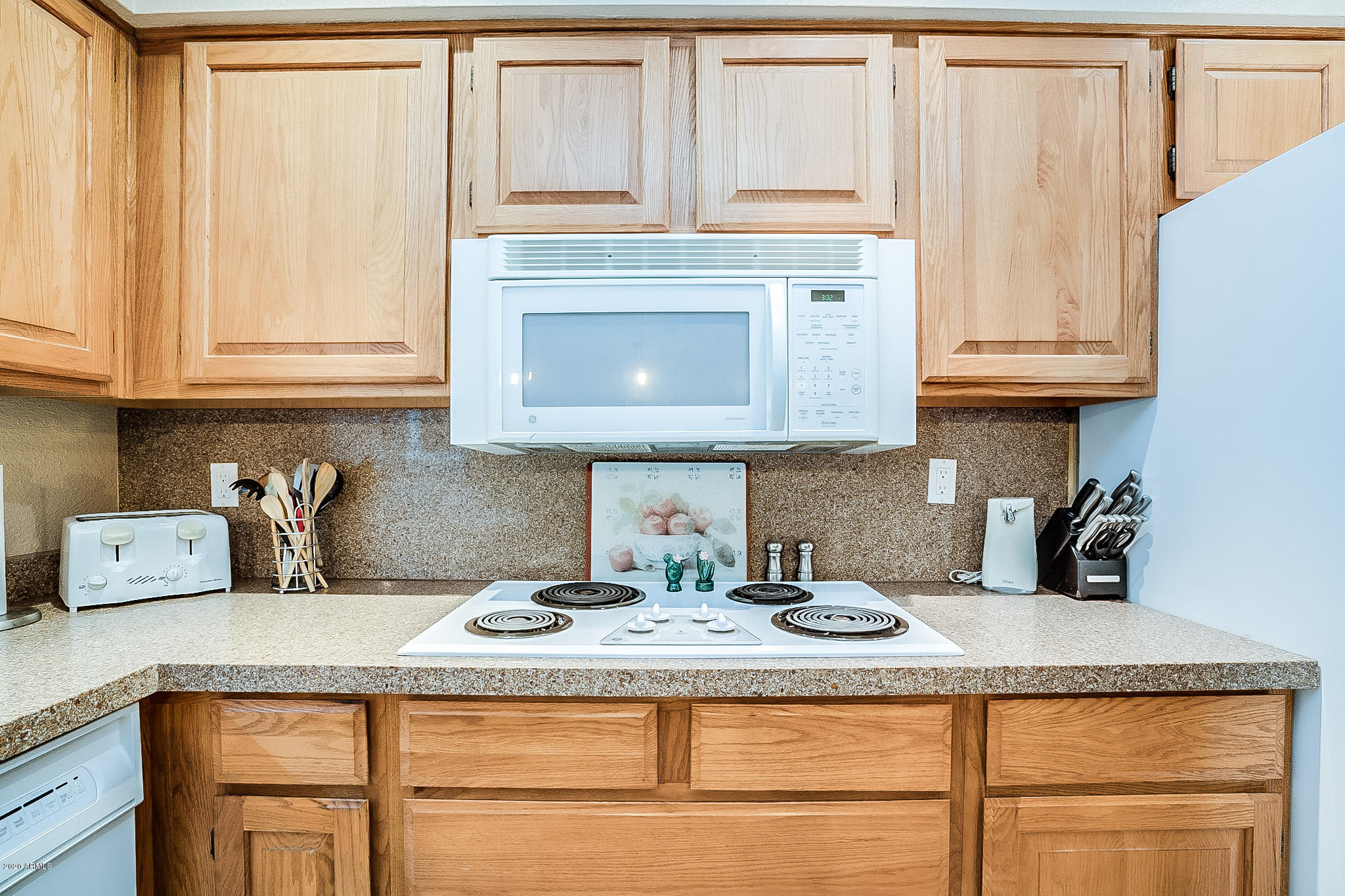 5630 South Outrigger Road Tempe, AZ 85283 - Photo 19 of 38 a kitchen with granite countertop cabinets and window