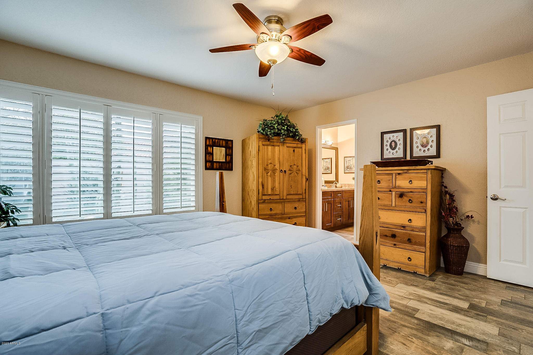 5630 South Outrigger Road Tempe, AZ 85283 - Photo 22 of 38 a spacious bedroom with a bed and a dresser